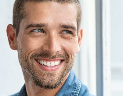 Man sharing bright smile after teeth whitening